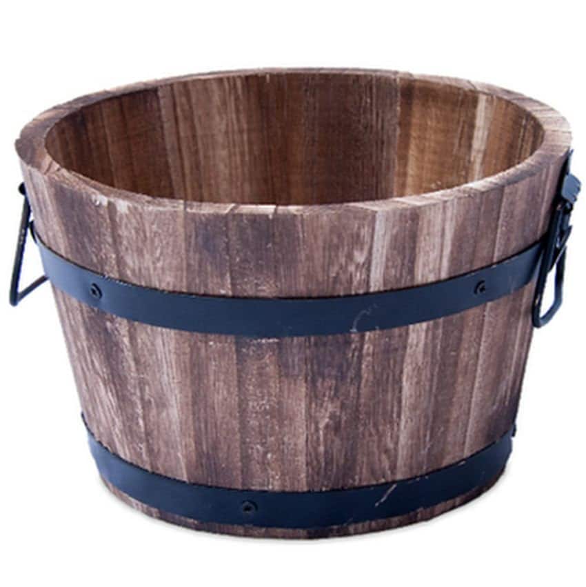 A wooden planter like a barrel, wood with metal around it