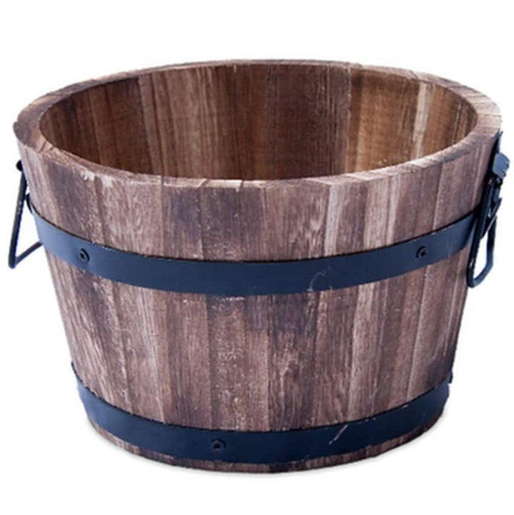 A wooden planter like a barrel, wood with metal around it