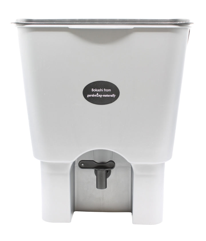 A single bokashi bin with tap on a white background
