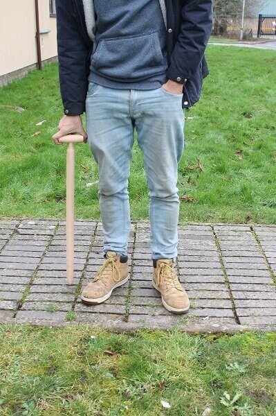 Long handled dibber bein held to show size
