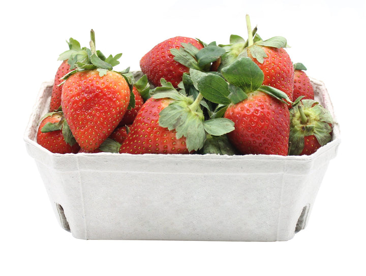 A fruit punnet with strawberries in it