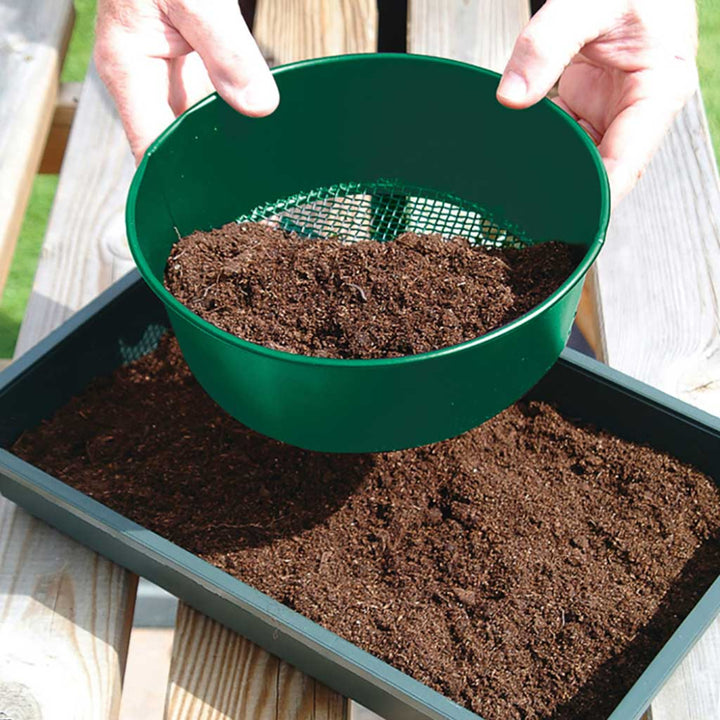 soil being sieved by soil sieve