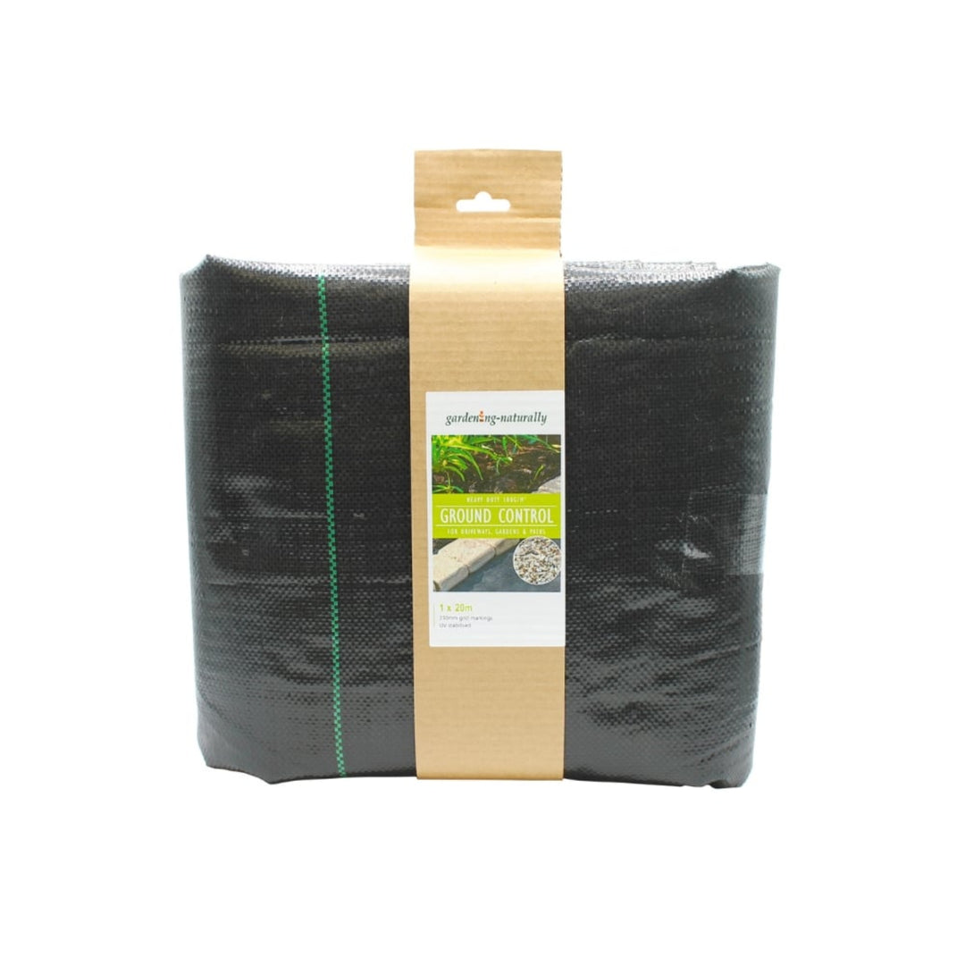 A folded black ground control weed barrier sheet.