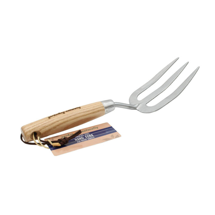 Gardening fork with wooden handle on a white background