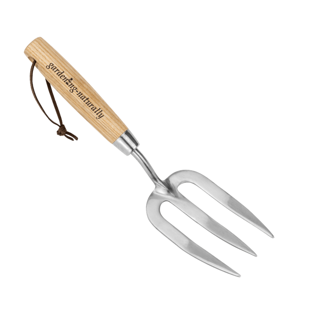 Gardening fork with wooden handle on a white background