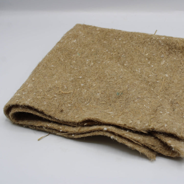 A folded piece of brown weed fabric with a textured, fibrous surface.