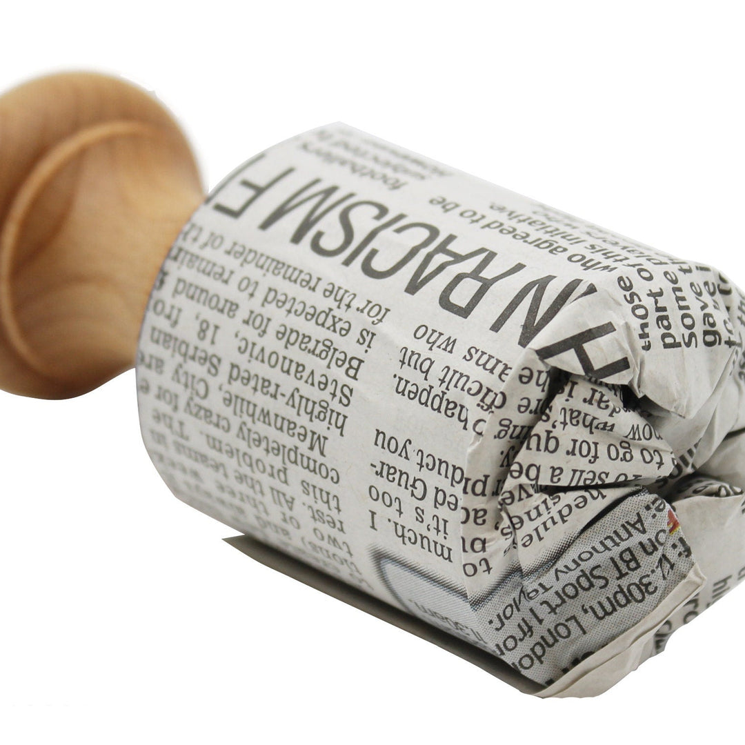 Pot being made out of newspaper on a white background