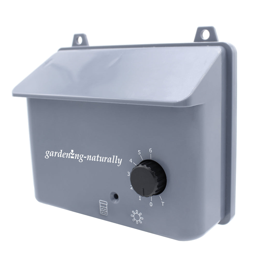 Gray control panel with a knob and 'gardening-naturally' branding on a white background