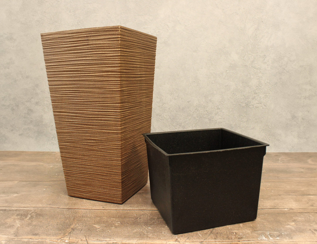 Tall ribbed plant pot coffee coloured shown with the inner pot