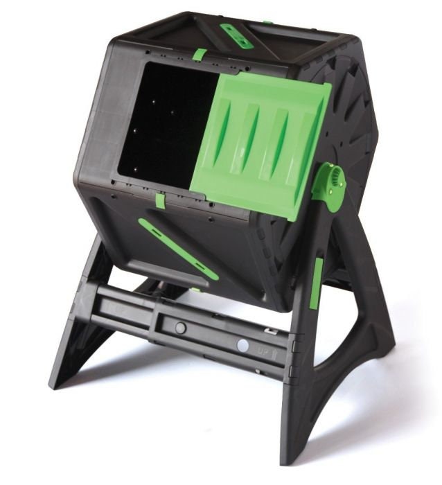 A black and green tumbling composter with visible brown ingredients inside, set on a sturdy base.