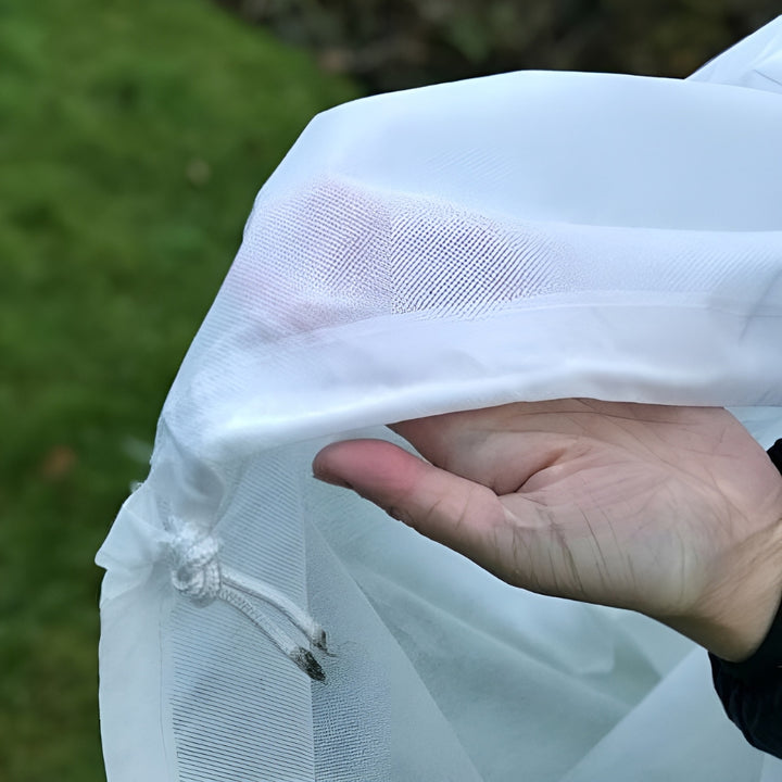 Close up of man holding white heavy duty fleece bag