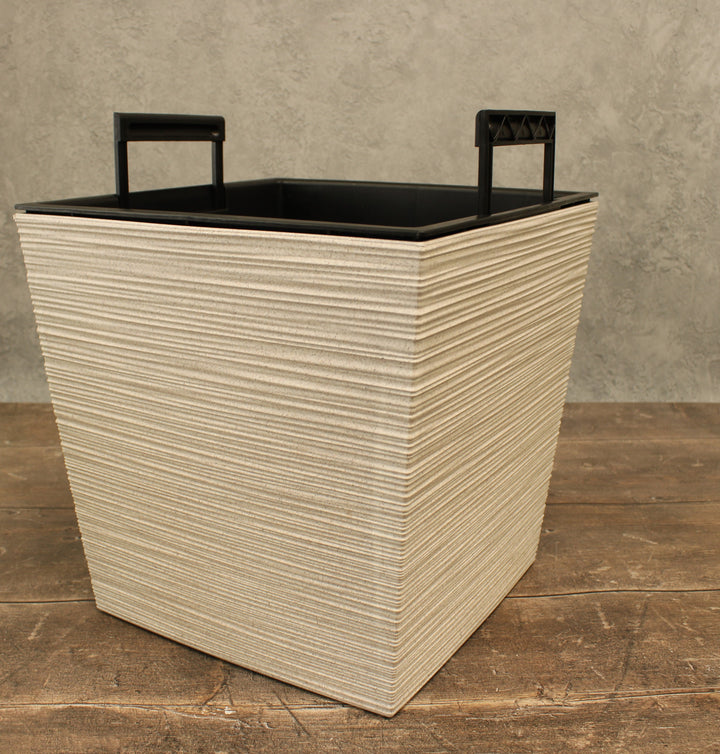 textured white pot with black inserts