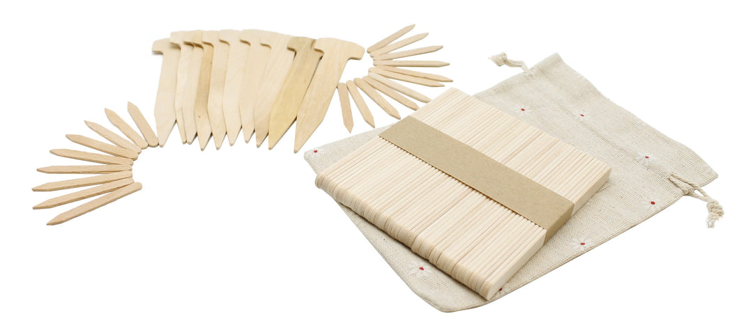 white woven drawstring bag with variety of wooden plant labels