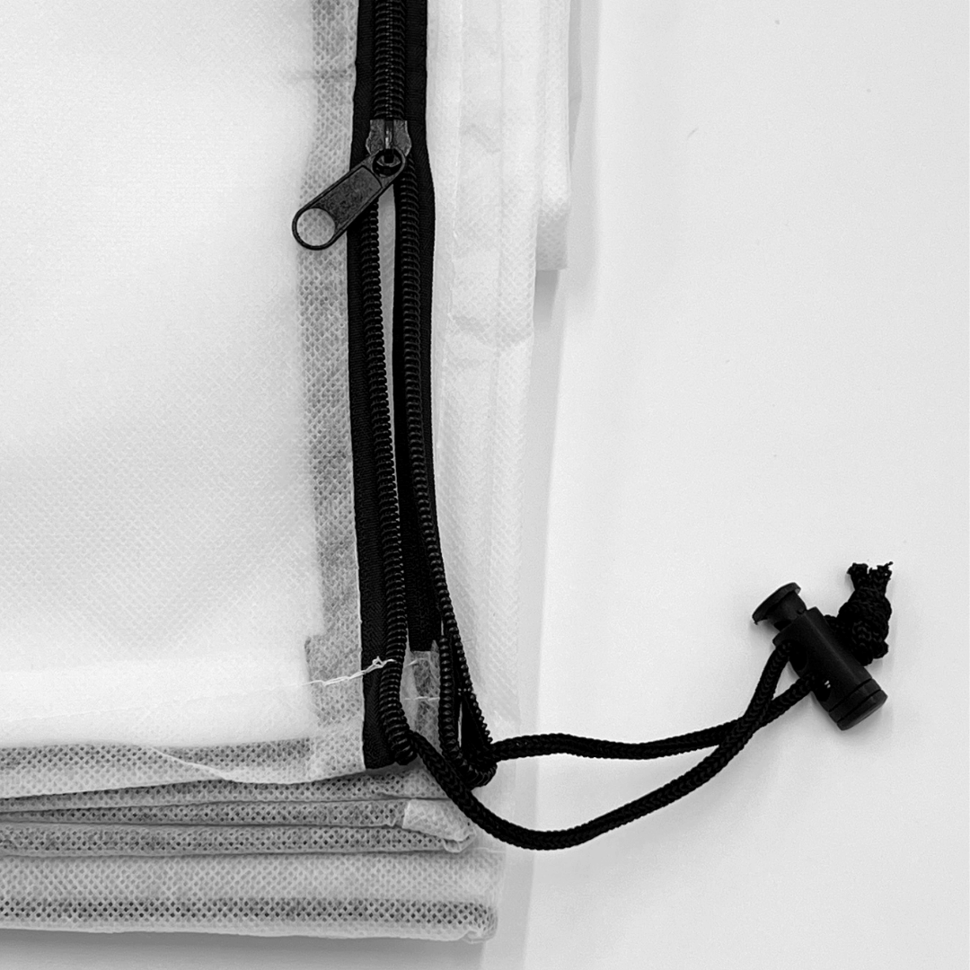 Close-up of a black zipper on a white background