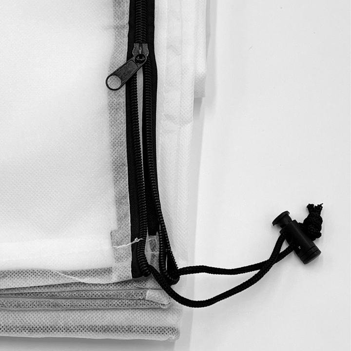 Close-up of a black zipper on a white background